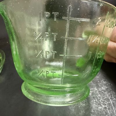 LOT 116: Vintage Uranium Glass Juicer and Measuring Cut. Set