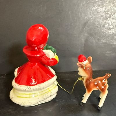 LOT 113: Vintage Kreisler Christmas Shopper with Reindeer and Napco Kissing Angel Shaker