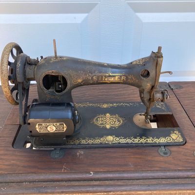 LOT 60: Vintage / Antique Rolling Singer Sewing Machine Cabinet with Wrought Iron Base