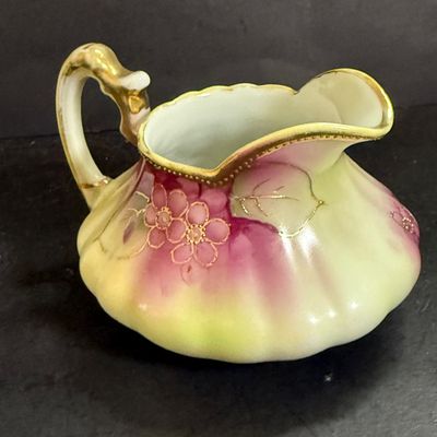 LOT 125: Collection of Painted Nippon Porcelain- Creamers, Pitcher, Plates and More