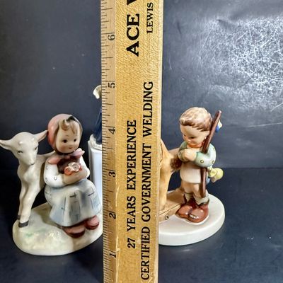 LOT 109: Set of 3 Goebel Hummel Figures - Pray Before Battle, Angel with Lantern, and Good Friends Girl with Lamb