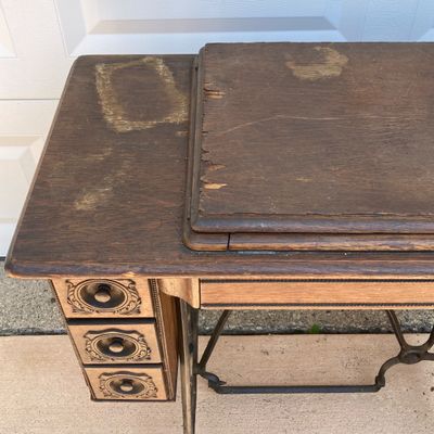 LOT 60: Vintage / Antique Rolling Singer Sewing Machine Cabinet with Wrought Iron Base
