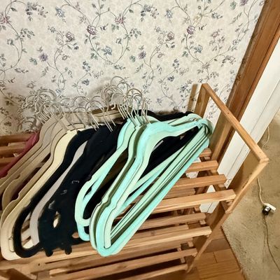 LOT 119: Set of 4 Stackable Cedar Shoe Racks and a Group of Cloth Hanger