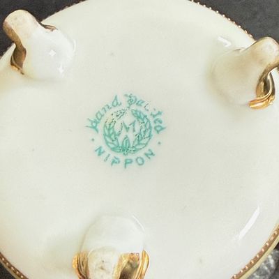 LOT 125: Collection of Painted Nippon Porcelain- Creamers, Pitcher, Plates and More