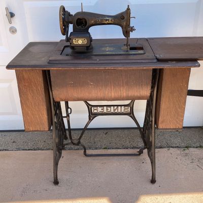 LOT 60: Vintage / Antique Rolling Singer Sewing Machine Cabinet with Wrought Iron Base