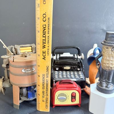 LOT 124: Mr Peanut Cast Iron Bank, ERTL Maytag Ringer Washing Machine Model, Mini Radio, Typewriter Teapot and More