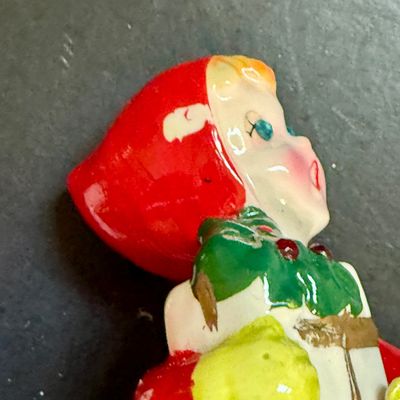 LOT 113: Vintage Kreisler Christmas Shopper with Reindeer and Napco Kissing Angel Shaker