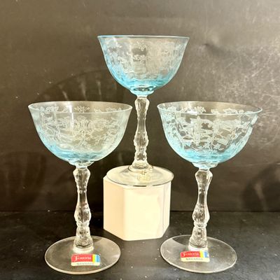 LOT 127: Fostoria Navarre Blue Stemmed Glasses and an Assortment of Other Color Glasses and More