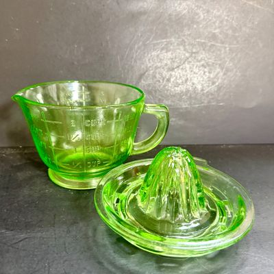 LOT 116: Vintage Uranium Glass Juicer and Measuring Cut. Set