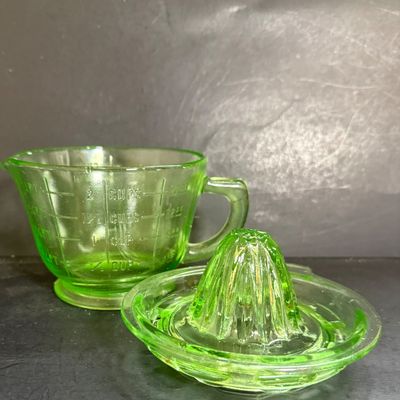 LOT 116: Vintage Uranium Glass Juicer and Measuring Cut. Set