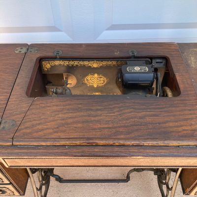 LOT 60: Vintage / Antique Rolling Singer Sewing Machine Cabinet with Wrought Iron Base