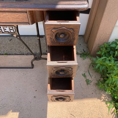 LOT 60: Vintage / Antique Rolling Singer Sewing Machine Cabinet with Wrought Iron Base