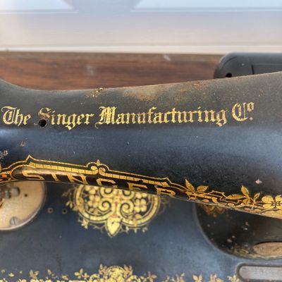 LOT 60: Vintage / Antique Rolling Singer Sewing Machine Cabinet with Wrought Iron Base