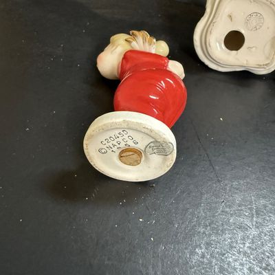 LOT 113: Vintage Kreisler Christmas Shopper with Reindeer and Napco Kissing Angel Shaker