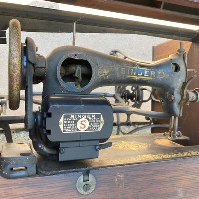 LOT 60: Vintage / Antique Rolling Singer Sewing Machine Cabinet with Wrought Iron Base