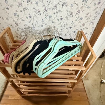 LOT 119: Set of 4 Stackable Cedar Shoe Racks and a Group of Cloth Hanger