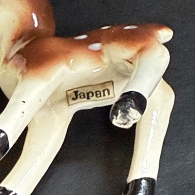 LOT 113: Vintage Kreisler Christmas Shopper with Reindeer and Napco Kissing Angel Shaker