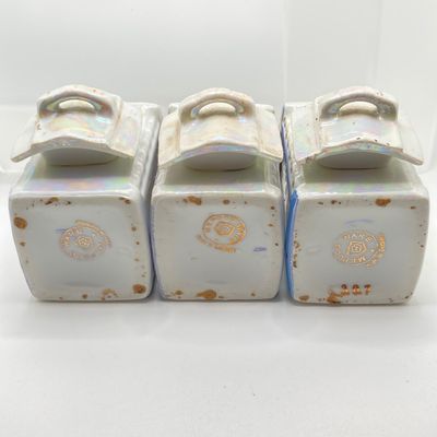 LOT 108: Six Vintage Mepoco Ware Made in Germany Lustreware Canisters / Spice Jars
