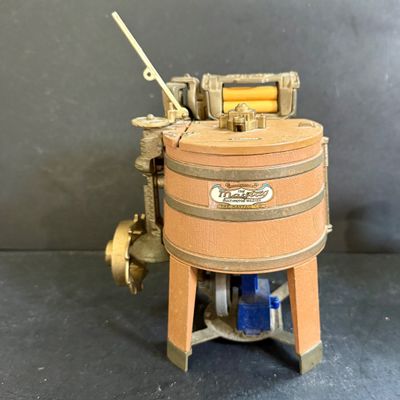 LOT 124: Mr Peanut Cast Iron Bank, ERTL Maytag Ringer Washing Machine Model, Mini Radio, Typewriter Teapot and More