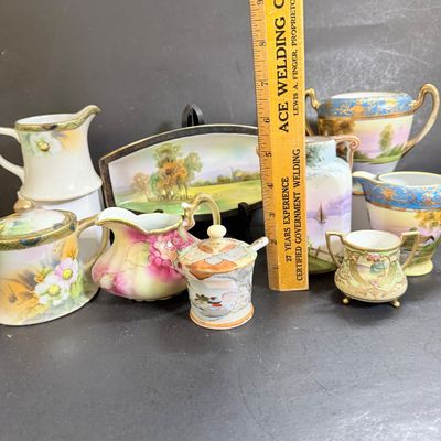 LOT 125: Collection of Painted Nippon Porcelain- Creamers, Pitcher, Plates and More