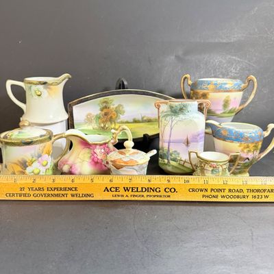 LOT 125: Collection of Painted Nippon Porcelain- Creamers, Pitcher, Plates and More