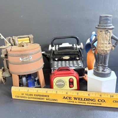 LOT 124: Mr Peanut Cast Iron Bank, ERTL Maytag Ringer Washing Machine Model, Mini Radio, Typewriter Teapot and More