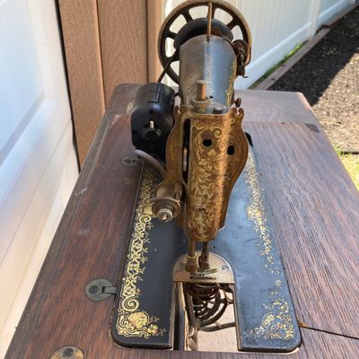 LOT 60: Vintage / Antique Rolling Singer Sewing Machine Cabinet with Wrought Iron Base