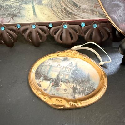 LOT 129: Victorian Christmas Sleigh Ride Decor Including Miniature Wood Sled, Pictures, Plates, Snow-globe and More