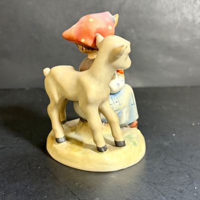 LOT 109: Set of 3 Goebel Hummel Figures - Pray Before Battle, Angel with Lantern, and Good Friends Girl with Lamb
