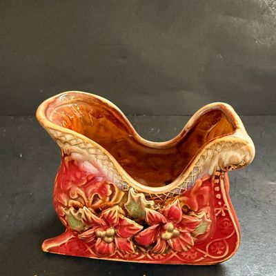 LOT 129: Victorian Christmas Sleigh Ride Decor Including Miniature Wood Sled, Pictures, Plates, Snow-globe and More