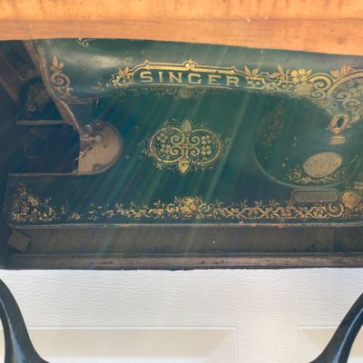 LOT 60: Vintage / Antique Rolling Singer Sewing Machine Cabinet with Wrought Iron Base