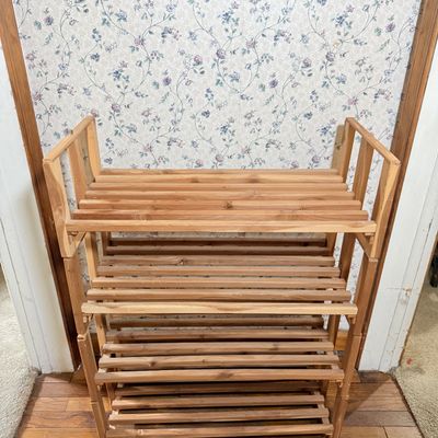 LOT 119: Set of 4 Stackable Cedar Shoe Racks and a Group of Cloth Hanger