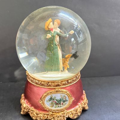 LOT 129: Victorian Christmas Sleigh Ride Decor Including Miniature Wood Sled, Pictures, Plates, Snow-globe and More