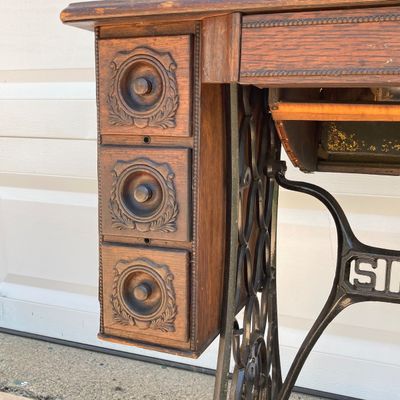 LOT 60: Vintage / Antique Rolling Singer Sewing Machine Cabinet with Wrought Iron Base