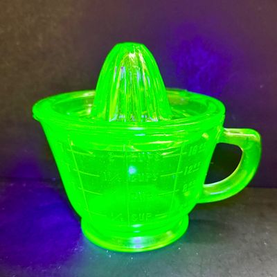 LOT 116: Vintage Uranium Glass Juicer and Measuring Cut. Set