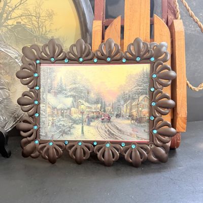 LOT 129: Victorian Christmas Sleigh Ride Decor Including Miniature Wood Sled, Pictures, Plates, Snow-globe and More