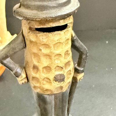 LOT 124: Mr Peanut Cast Iron Bank, ERTL Maytag Ringer Washing Machine Model, Mini Radio, Typewriter Teapot and More