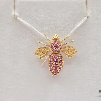 730 14kt gold broach with semi precious stones 3 1g