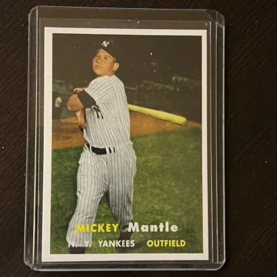 Vintage Mickey Mantle New York Yankees baseball card, housed in a protective plastic top loader.