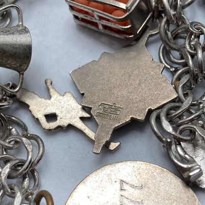 LOT 235: Vintage Elco Sterling Silver Charm Bracelet with Safety Chain and Charms - 54.3gtw