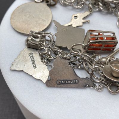 LOT 235: Vintage Elco Sterling Silver Charm Bracelet with Safety Chain and Charms - 54.3gtw