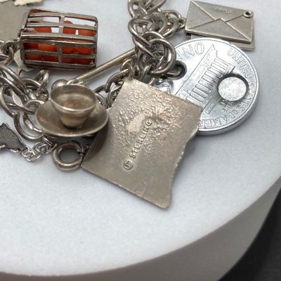 LOT 235: Vintage Elco Sterling Silver Charm Bracelet with Safety Chain and Charms - 54.3gtw