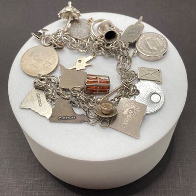 LOT 235: Vintage Elco Sterling Silver Charm Bracelet with Safety Chain and Charms - 54.3gtw