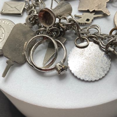 LOT 235: Vintage Elco Sterling Silver Charm Bracelet with Safety Chain and Charms - 54.3gtw