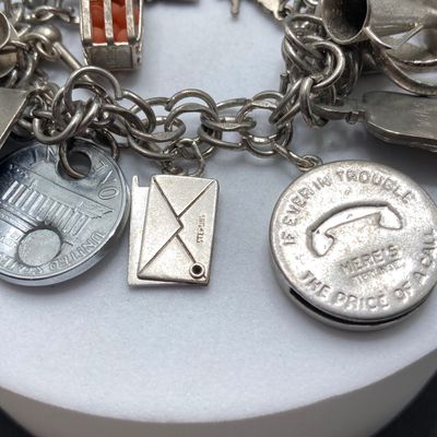 LOT 235: Vintage Elco Sterling Silver Charm Bracelet with Safety Chain and Charms - 54.3gtw
