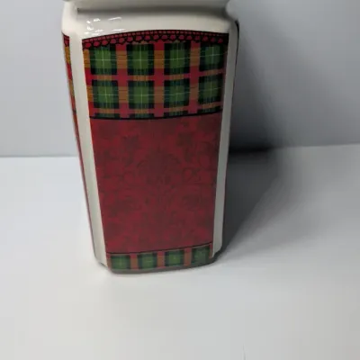 Sale Photo Thumbnail #159: The Christmas Scotty collection by 222 Fifth (PTS) is a highly sought-after holiday dinnerware line featuring a classic Scottish Terrier wearing an argyle sweater, set against a vibrant green, red, and yellow plaid backdrop. Because this specific holiday 