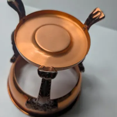 Sale Photo Thumbnail #9: The vintage Princess House copper and brass coffee carafe with stand is a popular 1960s and 1970s mid-century piece designed for elegant tabletop coffee or tea service