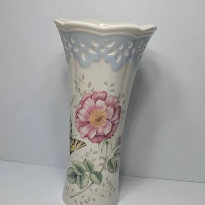 Sale Photo Thumbnail #56: The Lenox Butterfly Meadow vase, designed by artist Louise Le Luyer, is crafted from durable white porcelain and features iconic transferware of vibrant flowers, butterflies, and insects.