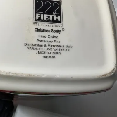 Sale Photo Thumbnail #161: The Christmas Scotty collection by 222 Fifth (PTS) is a highly sought-after holiday dinnerware line featuring a classic Scottish Terrier wearing an argyle sweater, set against a vibrant green, red, and yellow plaid backdrop. Because this specific holiday 