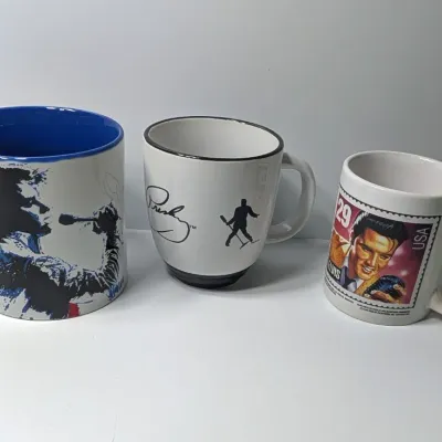 Sale Photo Thumbnail #165: Elvis Presley Stamp Mug, Silhouette Elvis Mug & one with bold letters